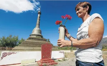  ?? Picture: ESA ALEXANDER ?? STUPA BATTLE: Yvonne Nell brings flowers to the Buddhist peace pagoda where she meditates on a farm outside Barrydale in the Western Cape. The farm’s new landowners want the monument removed