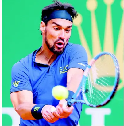  ?? AP ?? Italy’s Fabio Fognini returns the ball to Spain’s Rafael Nadal during their semi-final match of the Monte Carlo Tennis Masters tournament in Monaco yesterday.