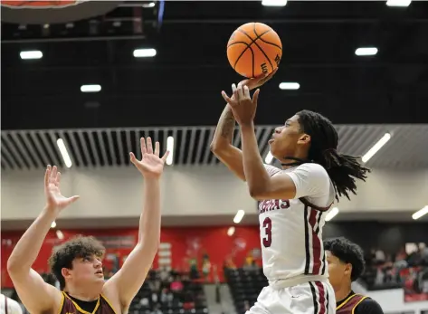  ?? (Special to the Commercial/William Harvey) ?? Pine Bluff senior Braylen Hall shoots a jumper during Saturday’s Class 5A state semifinal game against Lake Hamilton at Searcy High School.