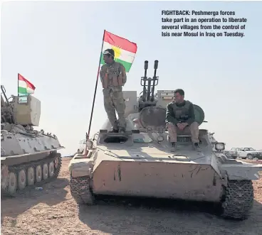  ??  ?? FIGHTBACK: Peshmerga forces take part in an operation to liberate several villages from the control of Isis near Mosul in Iraq on Tuesday.