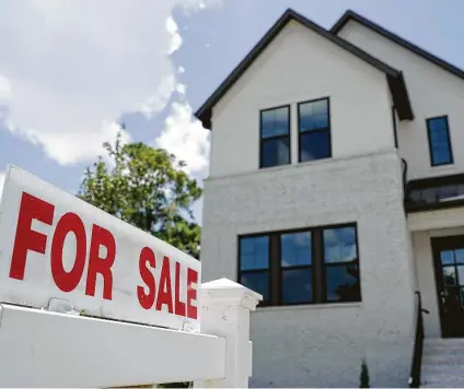  ?? Melissa Phillip / Staff file photo ?? This Houston home was for sale in July. Even with mortgage rates near all-time lows, rising home prices are putting more pressure on buyers to come up with bigger down payments — a trend that stretches the limits of affordabil­ity for many.