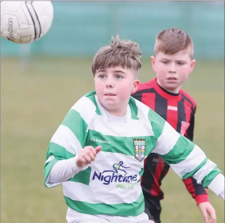  ??  ?? Donacarney’s matchwinne­r Jake Hough in keeps his eye on the ball during Sunday’s game against Westport United.