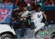  ?? Hector Vivas/Getty Images ?? Oscar González of New York Yankees is checked by doctors after getting hit in the face by a ball in the second inning during an exhibition game against Diablos Rojos at Estadio Alfredo Harp Helu on Monday in Mexico City.