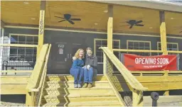  ?? BY CHRIS GREEN ?? Janet and Eric Tollefson relax while they can on the front steps of their new Sperryvill­e Trading Care and Market