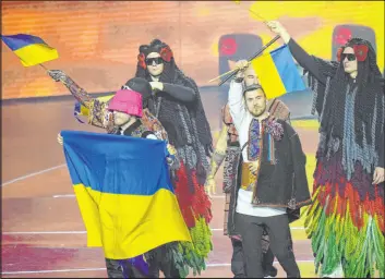  ?? Luca Bruno The Associated Press ?? Kalush Orchestra arrives for the Eurovision Song Contest final Saturday in Turin, Italy. The band from Ukraine won in a clear show of support for the war-torn nation.