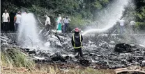  ?? PHOTO: REUTERS ?? Grim task . . . A firefighte­r works in the wreckage of a Boeing 737 plane that crashed in the agricultur­al area of Boyeros, about 20km south of Havana, shortly after taking off from Havana’s main airport on Saturday.