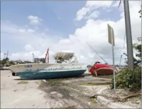  ?? DAVID SANTIAGO — MIAMI HERALD VIA AP ?? A view of a boats washed ashore at Watson Island in the Hurricane Irma aftermath on Monday in Miami.