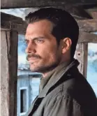  ??  ?? Cavill rocks the mustache and the mean as Walker – a far cry from his day job as Superman.