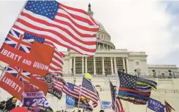  ?? KENT NISHIMURA/LOS ANGELES TIMES ?? Protesters gather Jan. 6, 2021, outside the Capitol, fueled by then-President Donald Trump’s continued claims of fraud in the 2020 election.