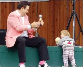  ?? Spceial to The Herald ?? Elvis tribute artist Jeff Bodner is joined on stage by a young Elvis fan during a recent show in Penticton. Presley remains popular with fans of all ages, 40 years after his death.