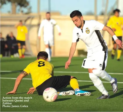  ??  ?? Action from the match between Qormi and Zabbar Photo: James Galea