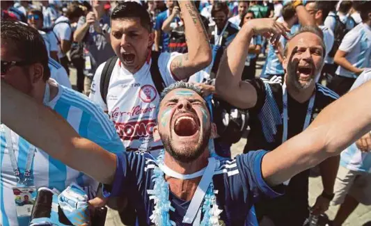  ?? REUTERS PIC ?? Argentina fans sing and chant before their match against Iceland yesterday.