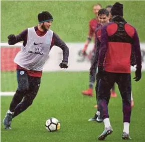  ?? AFP PIC ?? England midfielder Eric Dier (left) and teammates train at St George’s Park in Burton-on-Trent on Tuesday.