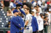  ?? NICK WASS/ASSOCIATED PRESS ?? Los Angeles Dodgers’ Trea Turner doffs his cap to the crowd as he is recognized with a tribute video before a baseball game Monday against the Washington Nationals in Washington.