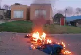  ??  ?? Protesters burned tyres in front of Councillor Langa Langa’s home.