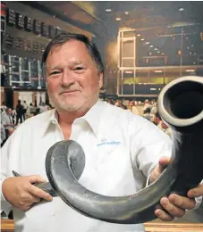  ?? /SUPPLIED ?? Unbundling: The late Lambert Retief, then nonexecuti­ve chairman of Novus Holdings, with a kudu horn at its listing on the JSE. Retief died in January.