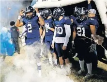  ?? [SARAH PHIPPS/ THE OKLAHOMAN] ?? El Reno's Dorian Plumley (2) waits to run onto the field before last Friday's Class 5A playoff game against Piedmont in El Reno.