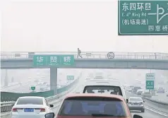  ??  ?? A man walks on a pedestrian bridge as heavy smog blankets China’s capital after the city issued its first air pollution alert for the winter season, in Beijing, China November 26. — Reuters photo