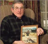  ?? File photo ?? Jack Schultz holds a 1988 photograph of his son Thomas at his home in Ridgefield in 2001. Thomas Schultz, a Syracuse University student, was killed in the Pan Am Flight 103 bombing over Lockerbie, Scotland on Dec. 21, 1988.