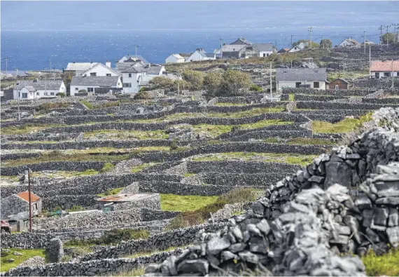  ?? Andy Haslam / New York Times ?? The view from the road to Synge's Chair, a perch of limestone frequented by the Irish playwright J.M. Synge in his day.