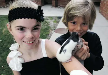  ?? RICK GUIDOTTI ?? Ten-year-old Tommy Glatzmayer, right, is one of Canada’s youngest recipients of a Diamond Jubilee Medal. He was honoured for his efforts to raise awareness of the rare disease Cornelia de Lange Syndrome, which afflicts his sister, Melanie, who is 12.