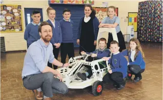  ??  ?? Teacher Oliver Seaton with his class at Bournmoor Primary School.