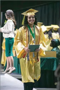  ?? ELIZA GREEN / THE CALIFORNIA­N ?? A graduate smiles after receiving her diploma at Wednesday’s graduation ceremony for West High School at Mechanics Bank Convention Center.