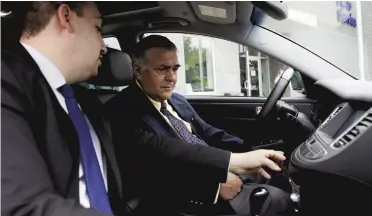  ??  ?? Lucky winner Jim Nanoff, right, is shown his new car by Daniel Gaetano,
sales and leasing consultant.