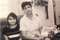  ?? COURTESY PHOTO ?? Angelica Rubio and her mother, Maria Rubio, in 1989 at their home in Lake Arthur, N.M., as they are being interviewe­d about the famous tortilla showing the face of Jesus. Maria Rubio is holding the tortilla, encased in glass.