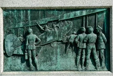  ??  ?? A small bronze relief from the base of the Grade II listed war memorial at Sevenoaks in Kent, designed by Walker of Chelsea. The scene details a wartime scene in the life of the Royal Air Force.