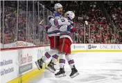  ?? KARL B DEBLAKER / AP ?? Chris Kreider celebrates his goal with Rangers teammate Adam Fox (23) during Game 7 of their playoff series with the Carolina Hurricanes.