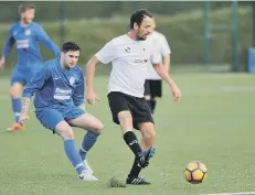  ??  ?? Hendon Athletic (white) taking on Myers.