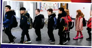  ??  ?? Lining up: Pupils arrive at Clyde Primary School in Glasgow