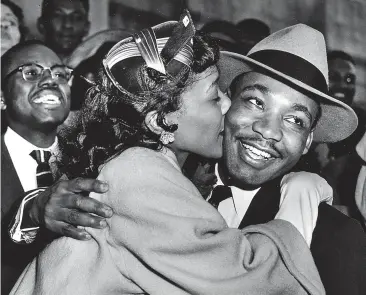  ??  ?? Hero activist: Martin Luther King Jr is given a kiss by his wife Coretta in 1956