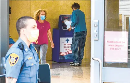  ?? MONICA CABRERA/MORNING CALL ?? Voters drop off ballots at the Northampto­n County Courthouse in Easton for the July 2020 primary.