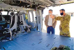  ?? ADOLPHE PIERRE-LOUIS/JOURNAL ?? U.S. Sen. Martin Heinrich, left, looks inside the HH-60W, the Air Force’s newest combat rescue helicopter, Monday at Kirtland Air Force Base.