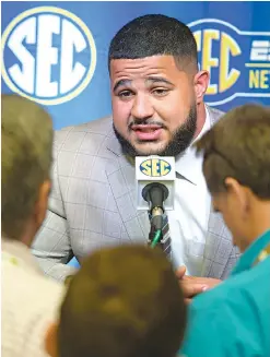  ?? AP Photo/John Amis ?? ■ Texas A&amp;M linebacker Erik McCoy is interviewe­d during a Southeaste­rn Conference media day Monday at the College Football Hall of Fame in Atlanta.