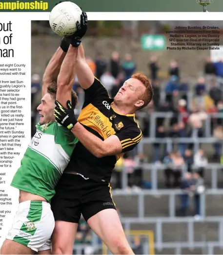  ??  ?? Johnny Buckley, Dr Crokes, punches the ball away from Billy McGuire, Legion, in the County SFC quarter-final at Fitzgerald Stadium, Killarney on Sunday Photo by Michelle Cooper Galvin