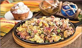  ?? COURTESY OF HUCKLEBERR­Y’S ?? The Mississipp­i — with ham, bacon, sausage, bell peppers, onions and mushrooms with Monterey jack cheese — is one of the skillet hotties served at Huckleberr­y’s.