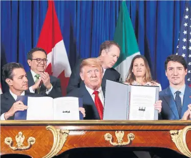  ?? PABLO MARTINEZ MONSIVAIS ASSOCIATED PRESS ?? The ink is barely dry on the new trade agreement, but there is already a push for changes, writes Jennifer Wells.