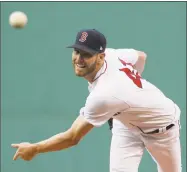  ?? Steven Senne / Associated Press ?? Red Sox starter Chris Sale delivers in the first inning against the Rangers on Wednesday in Boston.