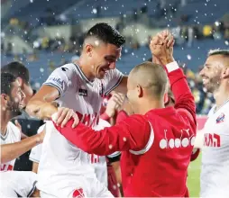  ?? (Danny Maron) ?? HAPOEL HAIFA celebrates after beating Beitar Jerusalem 2-0 last night at Teddy Stadium in the capital in the final game of the weekend in Israel Premier League action.