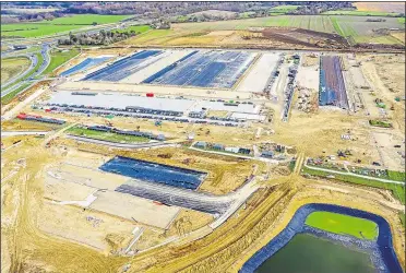  ??  ?? A view from above of the Brexit lorry park off the M20 at Sevington