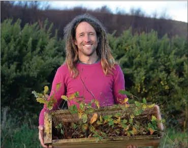  ?? Photo by Declan Malone ?? Darach Ó Murchú, armed with a box of oak saplings and looking forward to planting a community forest in West Kerry.