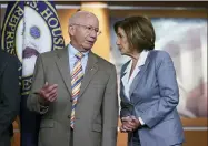  ?? AP PHOTO/J. SCOTT APPLEWHITE ?? House Transporta­tion and Infrastruc­ture Committee Chair Peter Defazio, D-ore., left, talks to Speaker of the House Nancy Pelosi, D-calif., during a news conference to discuss the “INVEST in America Act,” a five-year surface transporta­tion bill, which directs federal investment­s in roads, bridges, transit, and rail, at the Capitol in Washington, Wednesday, June 30, 2021.