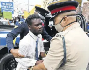  ?? (Photos: Joseph Wellington) ?? Police arrest one of the protesters.