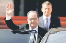 ??  ?? Hollande waves after the handover ceremony at the Elysee Palace. — Reuters photo