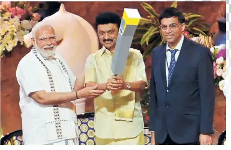  ?? AFP ?? The weight of expectatio­ns: Indian Prime Minister Narendra Modi (left) with Tamil Nadu Chief Minister M. K. Stalin (centre) and Viswanatha­n Anand at the inaugural ceremony of the 44th Chess Olympiad. Gelfand knows there will be pressure on Indian players to do well. “I hope they will take it in a positive way rather than be stressful,” he says.