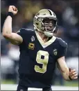  ?? BUTCH DILL — THE ASSOCIATED PRESS ?? Saints quarterbac­k Drew Brees reacts after throwing the second of his four TD passes against Atlanta.