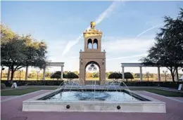  ??  ?? A plaza, fountain and 62-foot tower are among the focal points of Cranes Roost Park in Altamonte Springs.